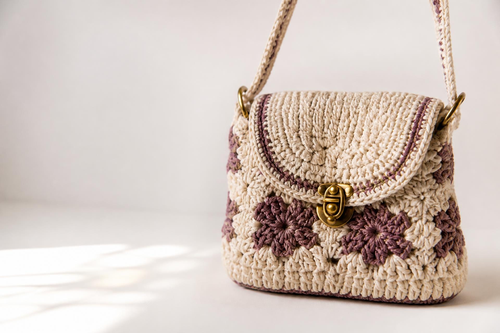 Handmade crochet handbags and a framed diamond painting in the Bellzbootik craft studio